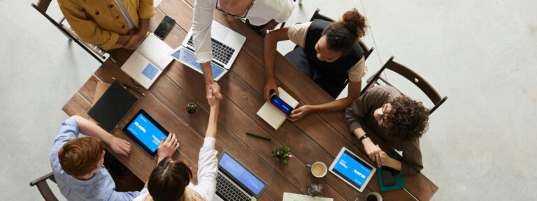 Top view of a diverse team collaborating in an office.